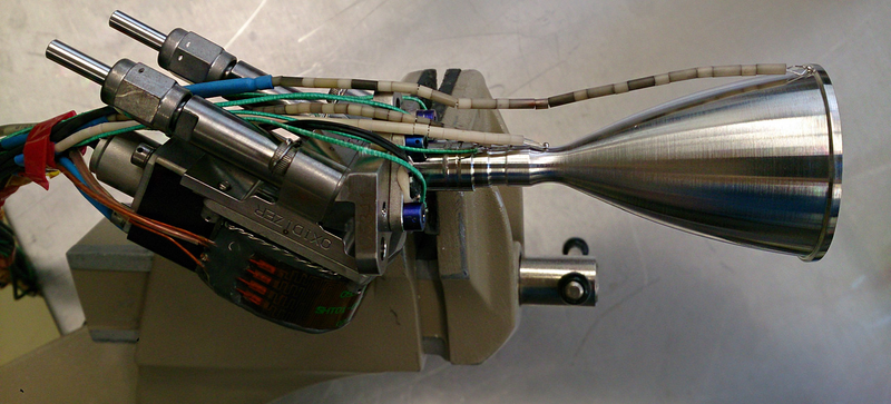 Illustration for article titled This Is the World's First 3D-Printed Platinum Spacecraft Thruster